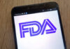 Close-up of a smartphone displaying the FDA logo