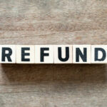 IRS Data REVEALS Unexpected Refund Boom This Year Wooden blocks spelling the word 'REFUND' on a wooden surface