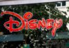 Bright red Disney logo displayed on a storefront window