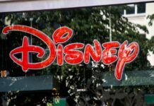 Bright red Disney logo displayed on a storefront window