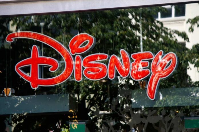Bright red Disney logo displayed on a storefront window
