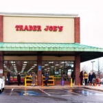 Trader Joe’s SLAMMED — Lawsuit Explodes Exterior view of a Trader Joe's grocery store with customers waiting outside