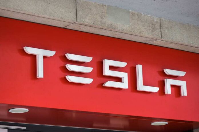 Tesla logo displayed on a red background
