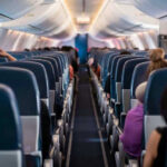 VIDEO: Cabin Door RIPS Open Midair Airplane interior with passengers seated mid-flight.