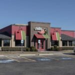 Exterior view of a Chili's restaurant with a parking lot