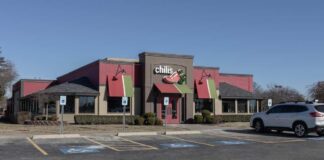 Exterior view of a Chili's restaurant with a parking lot