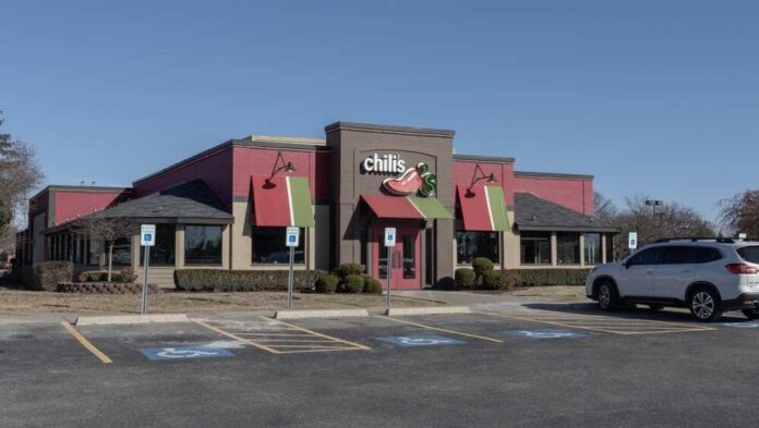 Exterior view of a Chili's restaurant with a parking lot