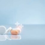More Major Drug Companies Join Trump Platform Assorted pills on a reflective surface against a light background