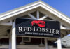 Sign for Red Lobster restaurant displaying fresh fish and live lobster