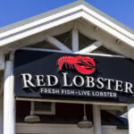 Sign for Red Lobster restaurant displaying fresh fish and live lobster