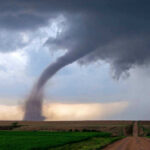 Tornado Destroys Homes — A Miracle Nobody Died Tornado touching down in an open field area.