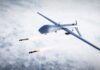 Spy Flight Surge Stuns Cuba Military drone releasing missiles in the sky