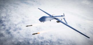 Military drone releasing missiles in the sky