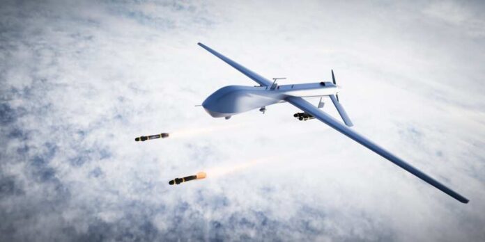 shutterstock_2176989617.jpg Military drone releasing missiles in the sky