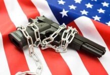 Publix Gun Reversal STUNS Shoppers A handgun wrapped in chains on an American flag