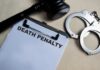 A gavel, handcuffs, and a document titled 'DEATH PENALTY'