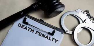 A gavel, handcuffs, and a document titled 'DEATH PENALTY'