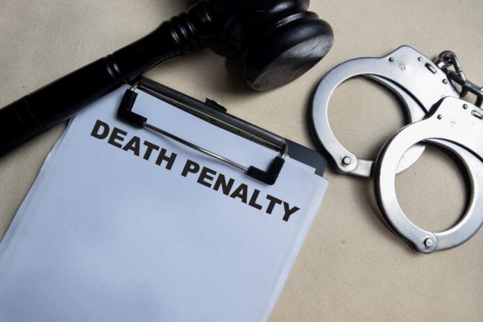 A gavel, handcuffs, and a document titled 'DEATH PENALTY'
