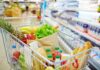 Grocer’s Bold Land Grab Revealed A shopping cart filled with fresh fruits, vegetables, and groceries