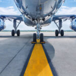 Lithium Battery Rules IGNORED – Flight Chaos! Airplane on runway with visible landing gear engines