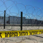 Supreme Court Greenlights Tough Border Move Border patrol tape and barbed wire fence.