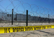 Supreme Court Greenlights Tough Border Move Border patrol tape and barbed wire fence.