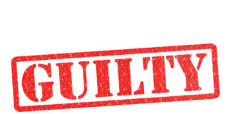 Red stamp with the word guilty inside