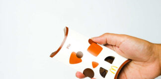 Hand holding a boxed handheld pie