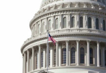 House GOP Rebels Challenge Trump In Key Vote U.S. Capitol dome with American flag flying.