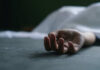 VIDEO: Death Squad Strikes – 12 Dead Dead persons hand lying on a gray surface