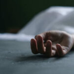 VIDEO: Death Squad Strikes – 12 Dead Dead persons hand lying on a gray surface