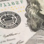 Savings Cliff: America’s Savings Vanishing Close-up of U.S. banknote with Federal Reserve seal and portrait detail