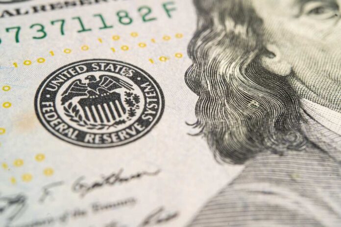 Close-up of U.S. banknote with Federal Reserve seal and portrait detail