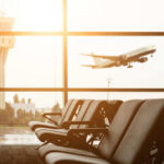 Airline Pilot Claims Drone Slam?! View of an airport terminal with an airplane taking off in the background