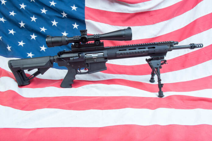 An,Ar-15,On,An,American,Flag U.S. Supreme Court building with American flag.