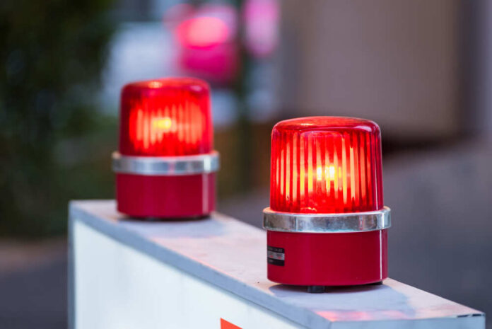 red warning beacons on a barrier
