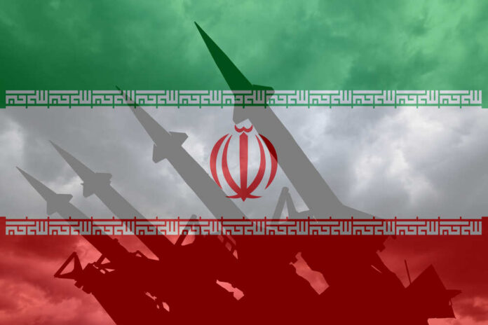 Missile,Launcher,On,The,Background,Of,The,Flag,Of,Iran. Silhouette of missiles in front of the Iranian flag