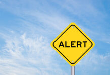 Forecast Chaos Fuels Bertha Backlash Yellow alert sign against a blue sky