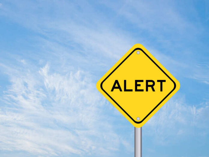 Yellow,Transportation,Sign,With,Word,Alert,On,Blue,Sky,Background Yellow alert sign against a blue sky