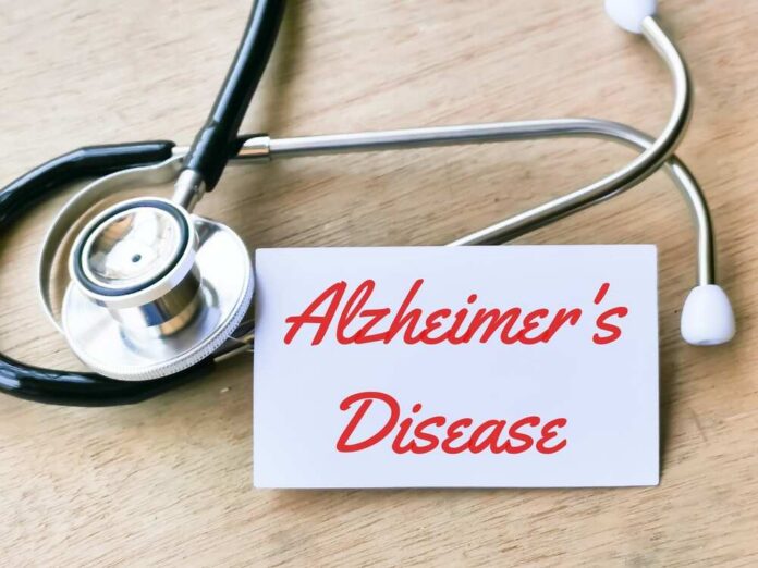 Text,Alzheimer's,Disease,Written,On,White,Card,With,Stethoscope. A healthcare professional preparing a syringe from a vial