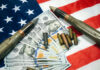 Pentagon Money Blaze Stuns Congress American flag with money bullets and weapons on top