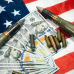 Pentagon Money Blaze Stuns Congress American flag with money bullets and weapons on top