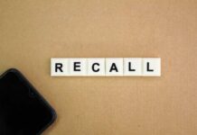 Massive Pillsbury Recall – Details Here! Letter tiles spelling recall on cardboard with a smartphone corner