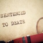 Florida’s Grim Double Death Row Day Close-up of a typewritten document stating 'SENTENCED TO DEATH'
