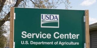 Recall notice over grocery store shelves.