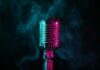 Beloved Music Icon’s Quiet Battle Stuns Fans A vintage microphone surrounded by colorful smoke