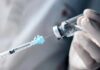 Ozempic’s Hidden Workplace Shock A healthcare professional preparing a syringe from a vial
