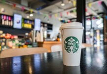 Coffee Lovers: Surprise Heart Edge Coffee cup on table in cafe interior