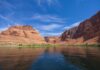 Power Cutoff Looms at Glen Canyon Red rock canyon with river under a bright blue sky