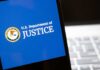 U.S. Department of Justice logo on a smartphone screen